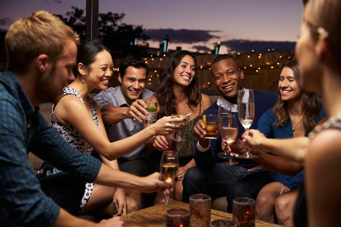 Friends on the roof deck at dusk